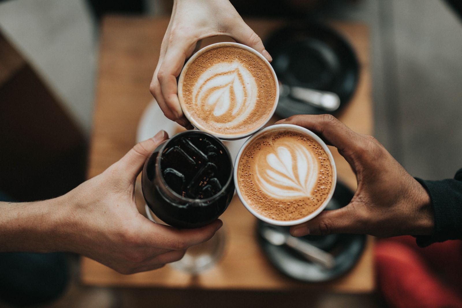 hands holding coffee